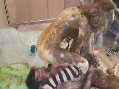 Two scat whores covered in crap in a scat 69 position